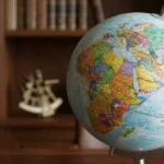 Illustrated classroom globe showing Africa, Europe, and western Asia, used to represent geography as the study of Earth, places, regions, and spatial relationships