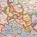 Close-up of a colorful map highlighting European countries and their geographical borders.