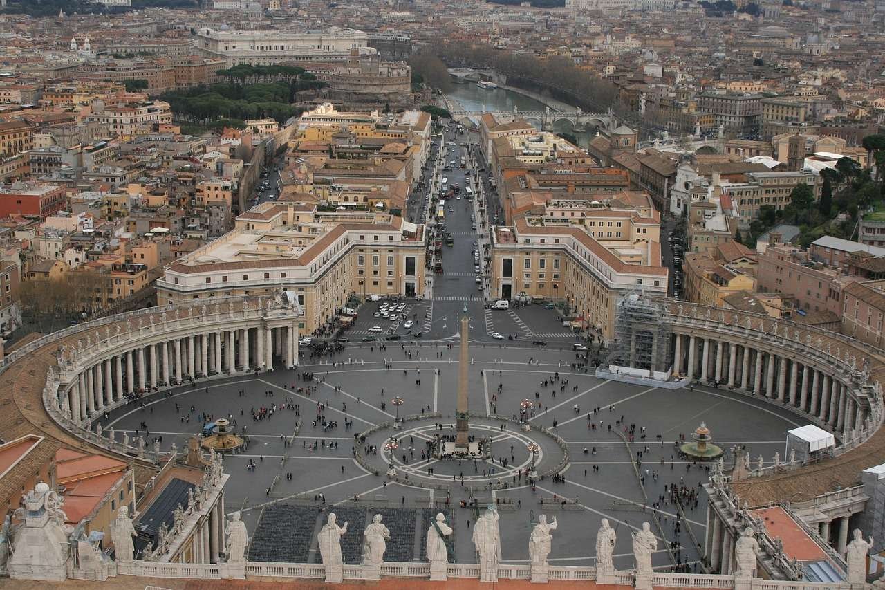 Aerial view of St. Peter’s Square in Vatican City, showing the semicircular colonnades and central obelisk