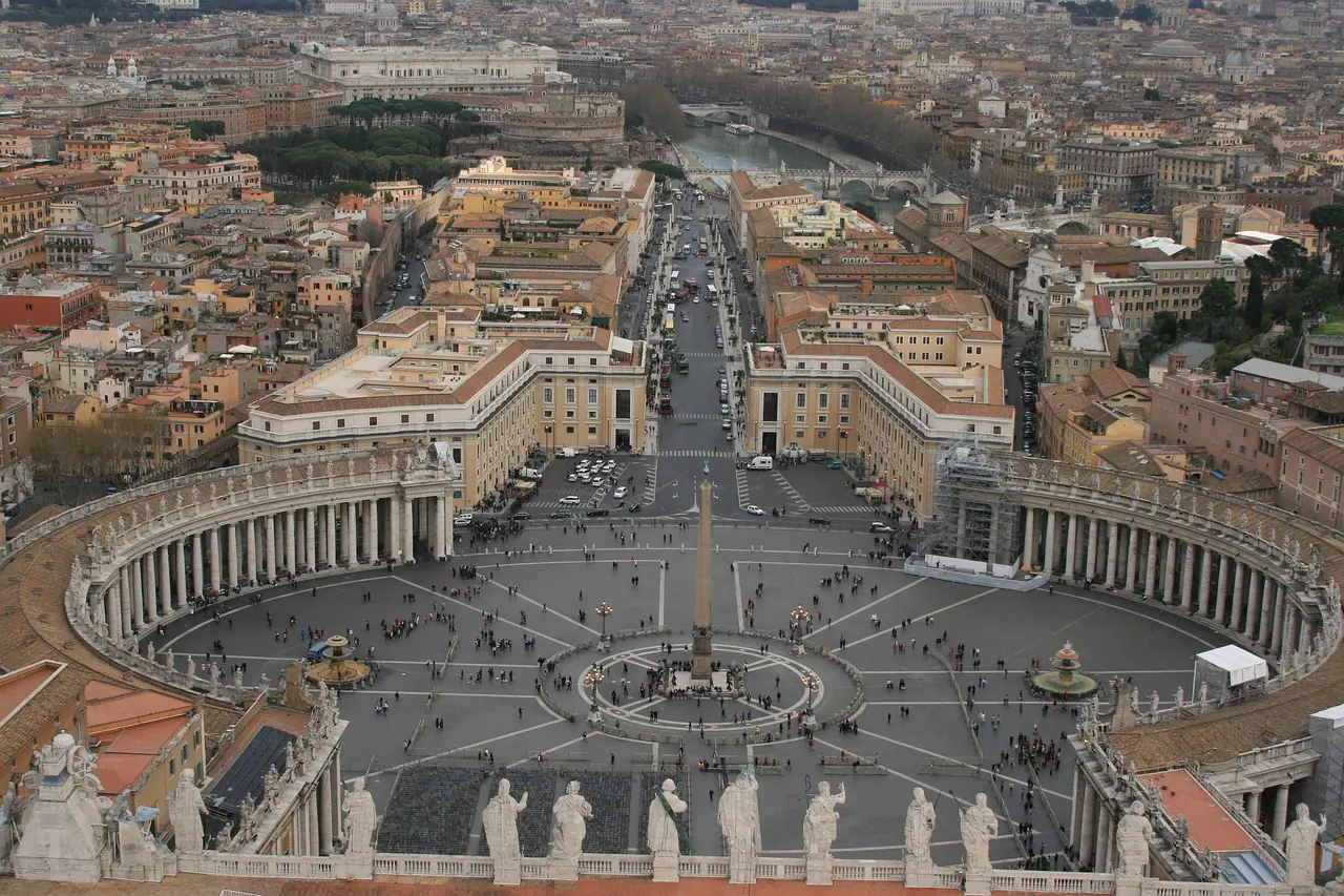 Aerial view of St. Peter’s Square in Vatican City, showing the semicircular colonnades and central obelisk