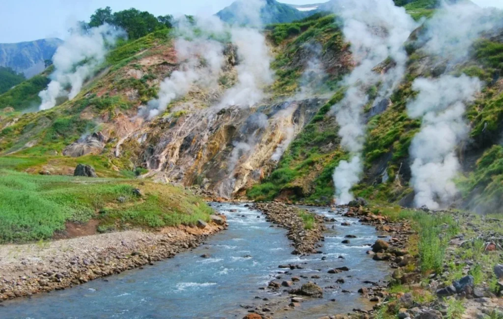 Steaming geysers and hot springs along the Geysernaya River in Kamchatka’s Valley of Geysers