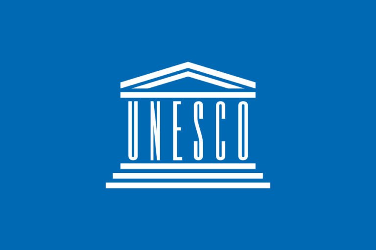 Flag of UNESCO with the official UN-style emblem symbolizing global cooperation in education, science, and culture.