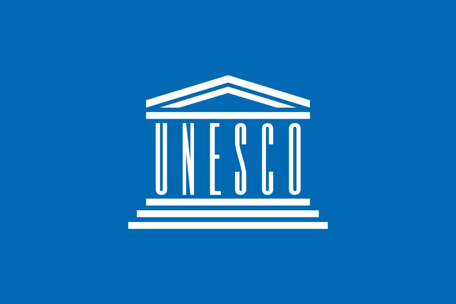 Flag of UNESCO with the official UN-style emblem symbolizing global cooperation in education, science, and culture.
