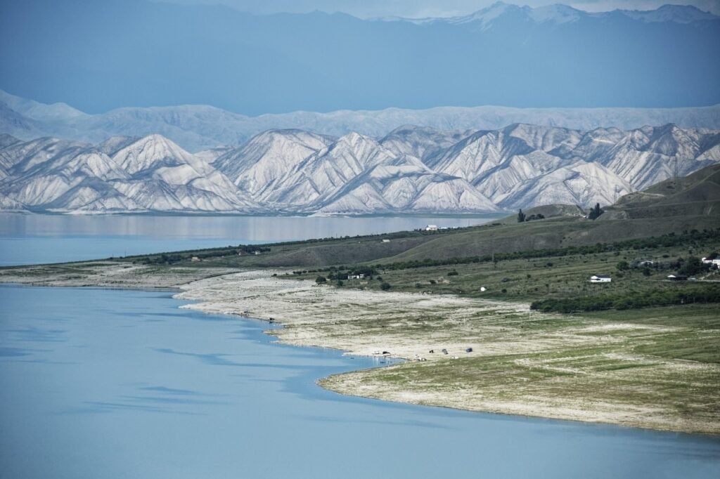 Toktogul Reservoir shoreline with rugged Tian Shan mountains in Kyrgyzstan