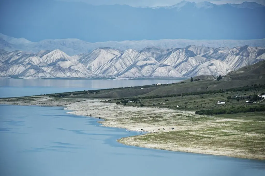 Toktogul Reservoir shoreline with rugged Tian Shan mountains in Kyrgyzstan