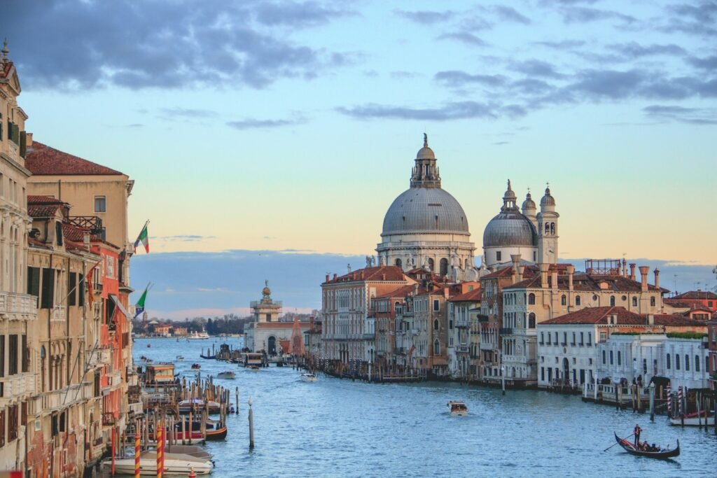 Basilica di Santa Maria della Salute from the Grand Canal at dusk, Venice, Italy.