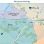 Stylised map of the Suwałki Gap showing NATO territory in Poland and Lithuania between Russia’s Kaliningrad exclave and Belarus, with the Via Baltica, Rail Baltica and overlapping A2/AD coverage circles.