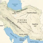 Relief map of Iran labeling the Iranian Plateau, Zagros and Alborz Mountains, Dasht-e Kavir, Dasht-e Lut, the Caspian Sea, Persian Gulf, Gulf of Oman, and the Strait of Hormuz with Tehran, Bandar Abbas, and Chabahar.