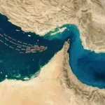 Satellite-style view of the Strait of Hormuz with many tankers backed up on the Persian Gulf side of the chokepoint.