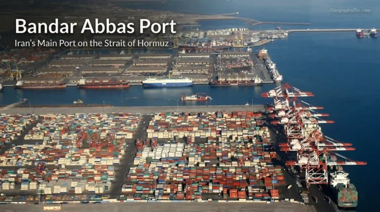 Aerial view of Bandar Abbas Port showing container yards, cranes, cargo ships, and terminal basins on Iran’s Strait of Hormuz coast.