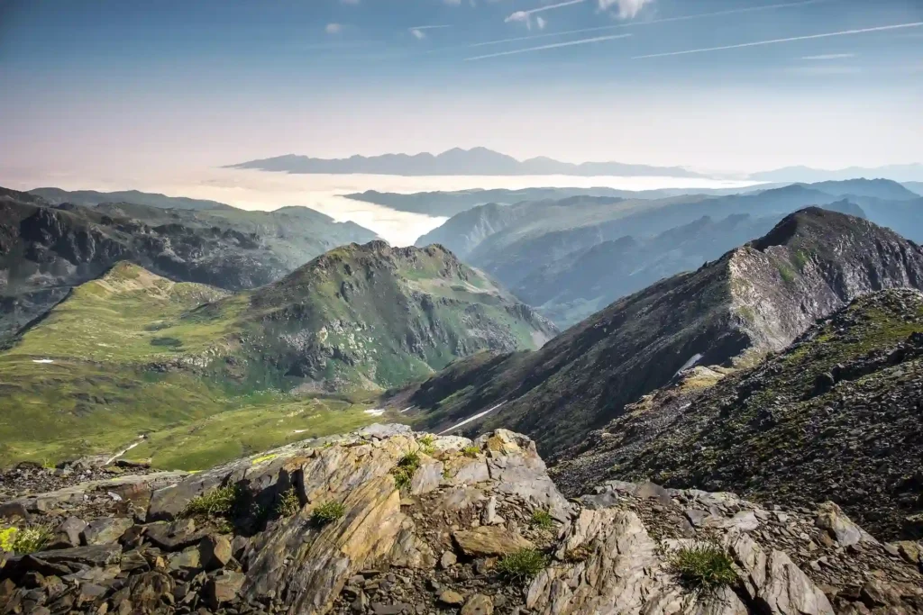High mountain landscape in Andorra with rocky Pyrenean ridges and deep valleys stretching into the distance