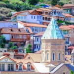 Old Tbilisi hillside with traditional houses and a church dome in central Tbilisi, Georgia