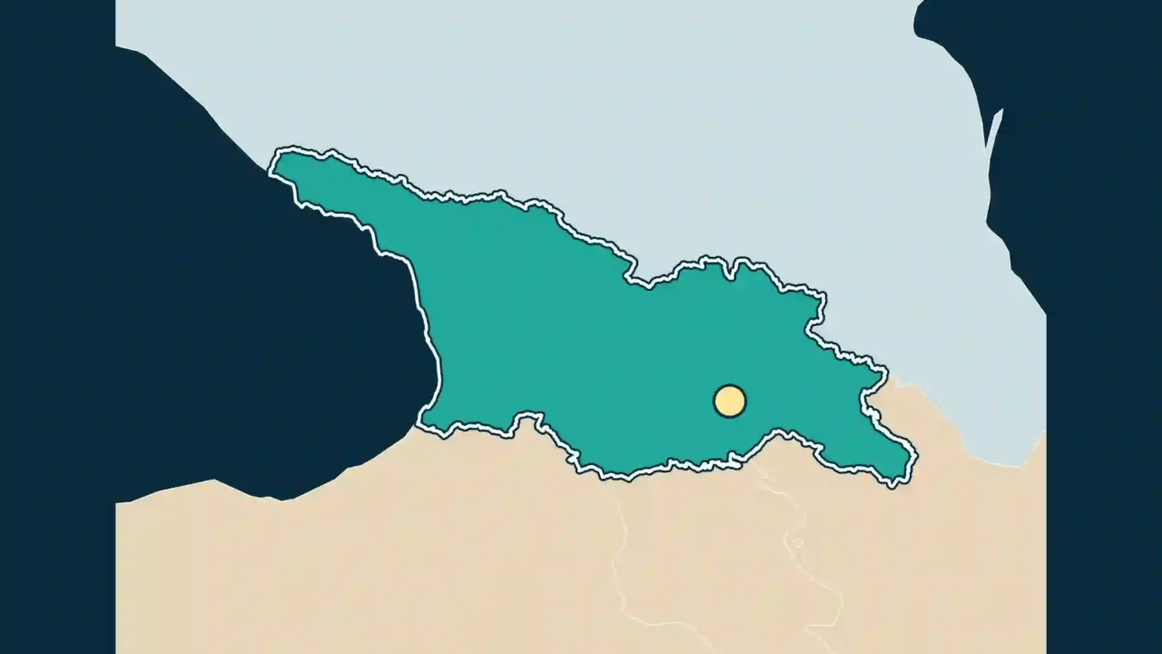 Georgia highlighted on a map of the South Caucasus, with Tbilisi marked by a yellow dot.